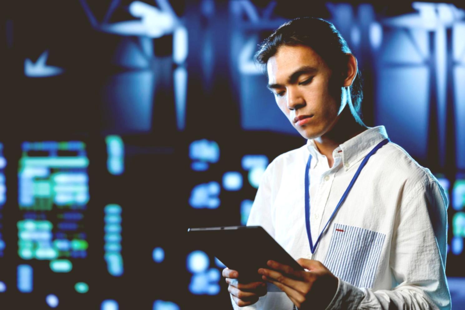 Development team collaborating on mobile game prototype with user testing feedback displayed on screens